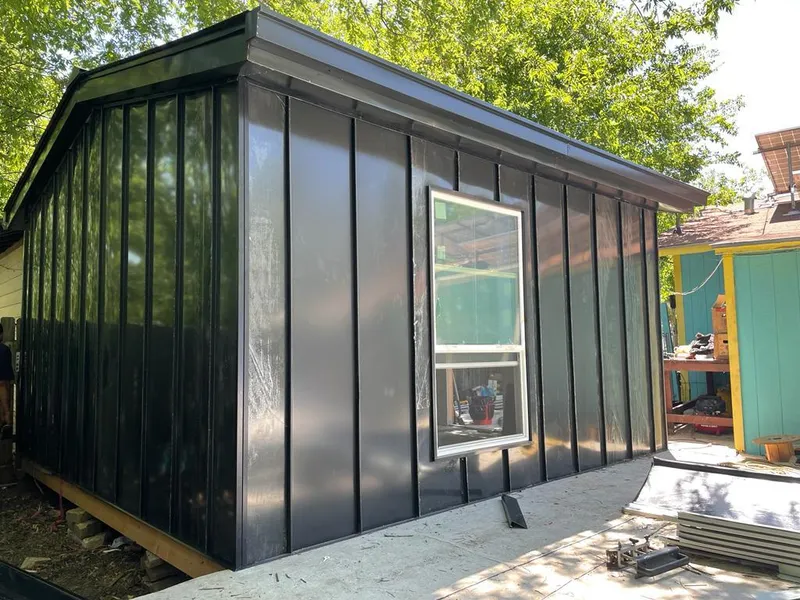 Black standing seam metal wall panels for Roof Inspection in Groveland